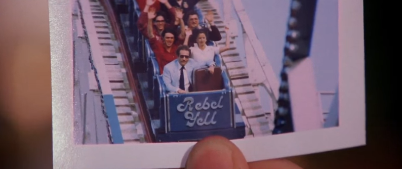 A souvenir picture from the ride, George Segal is in the front row of the coaster, the front of the train says Rebel Yell