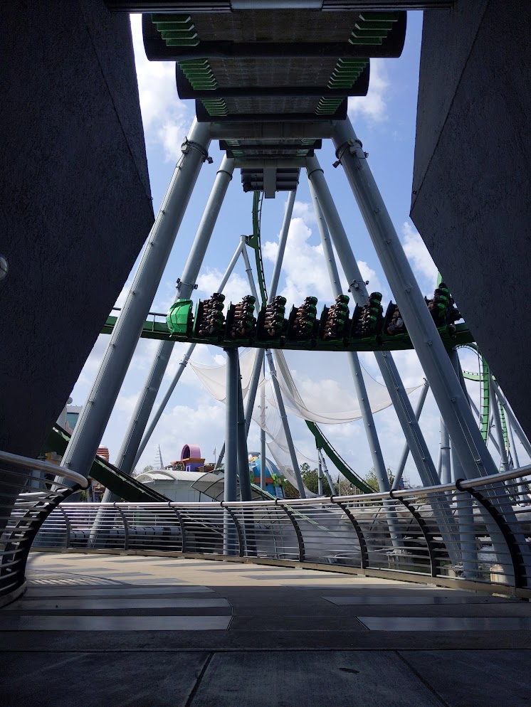 Hulk coaster from under the lift hill, the train is near dead venter of the tracks that cross the opening