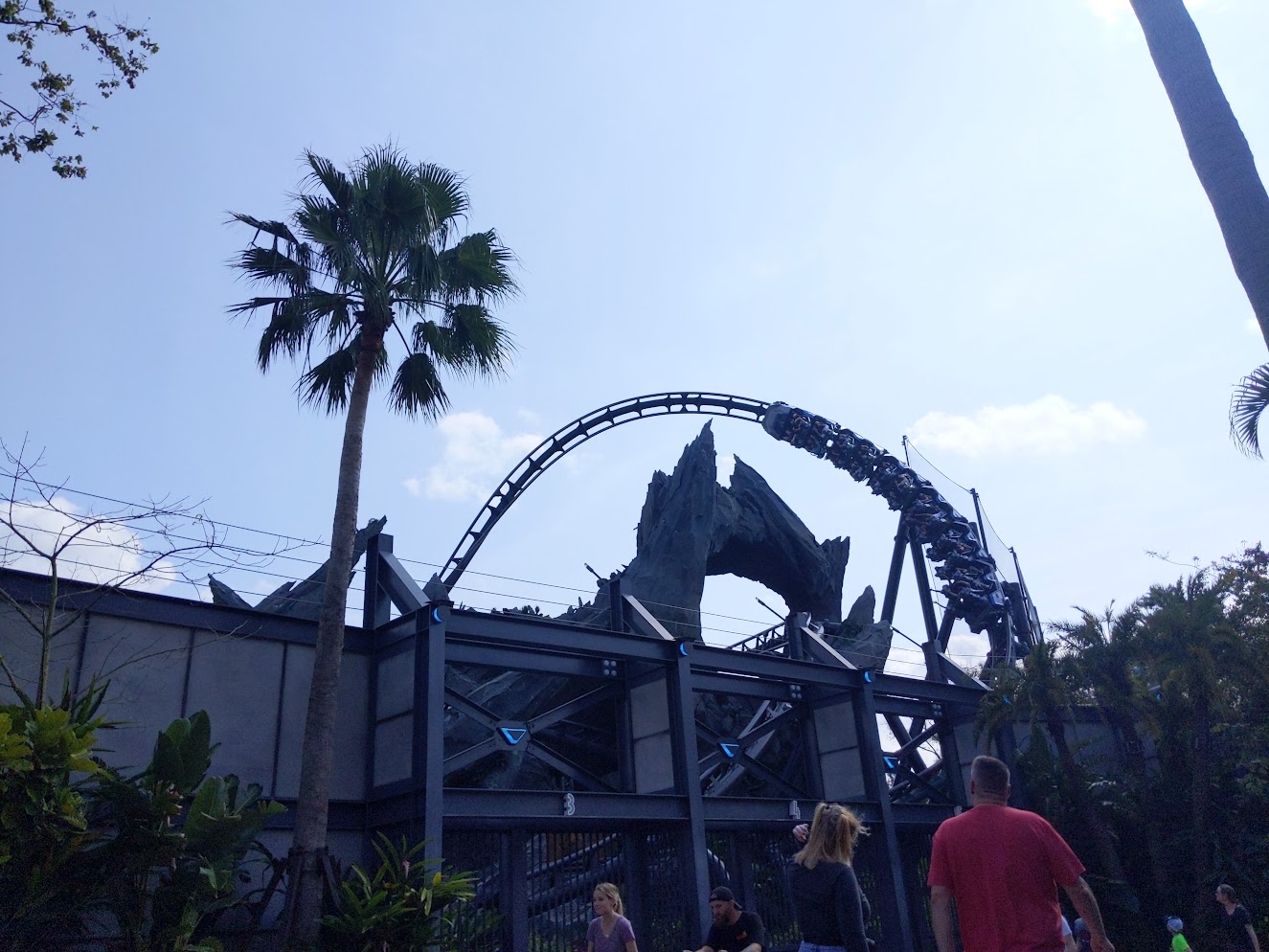 Velocicoaster's train cresting over the mountain in the paddock section of the ride
